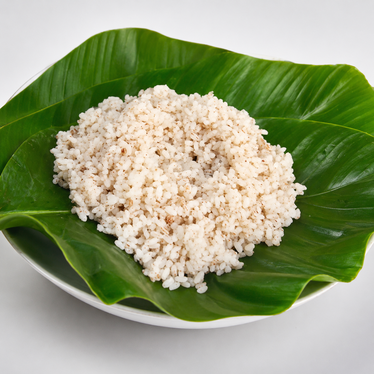 Ofada rice — Unpolished local rice served the traditional way, on fresh leaves